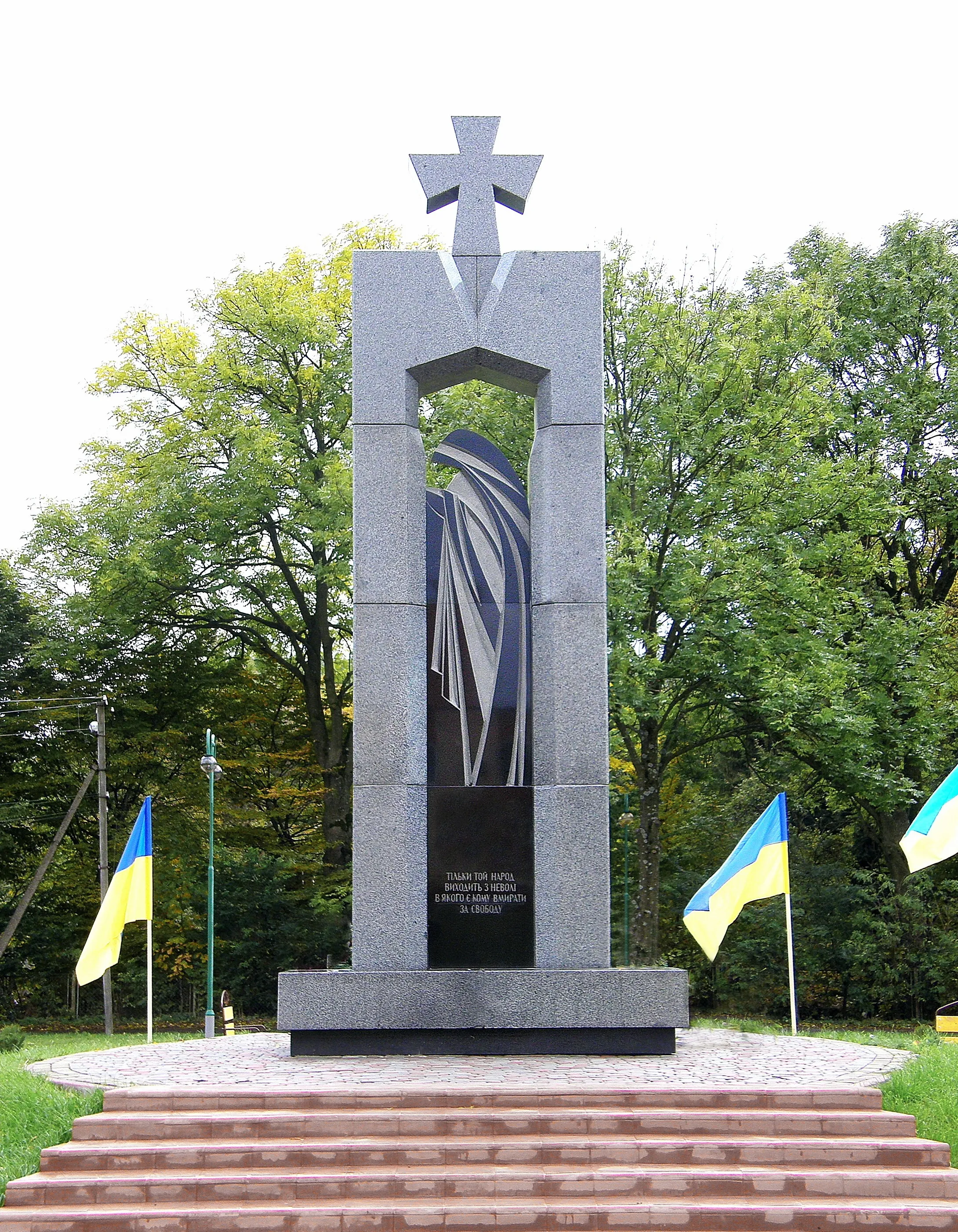 Image of Stele to the fallen warriors "FIGHTERS FOR UKRAINE`S FREEDOM" by Roman Kykta, size: 6500/3000/2000 мм, made of Stone: granite, gabbro, Sculpture Monuments medium, from village. Obroshino, Lviv region. Photo 2 of 3.