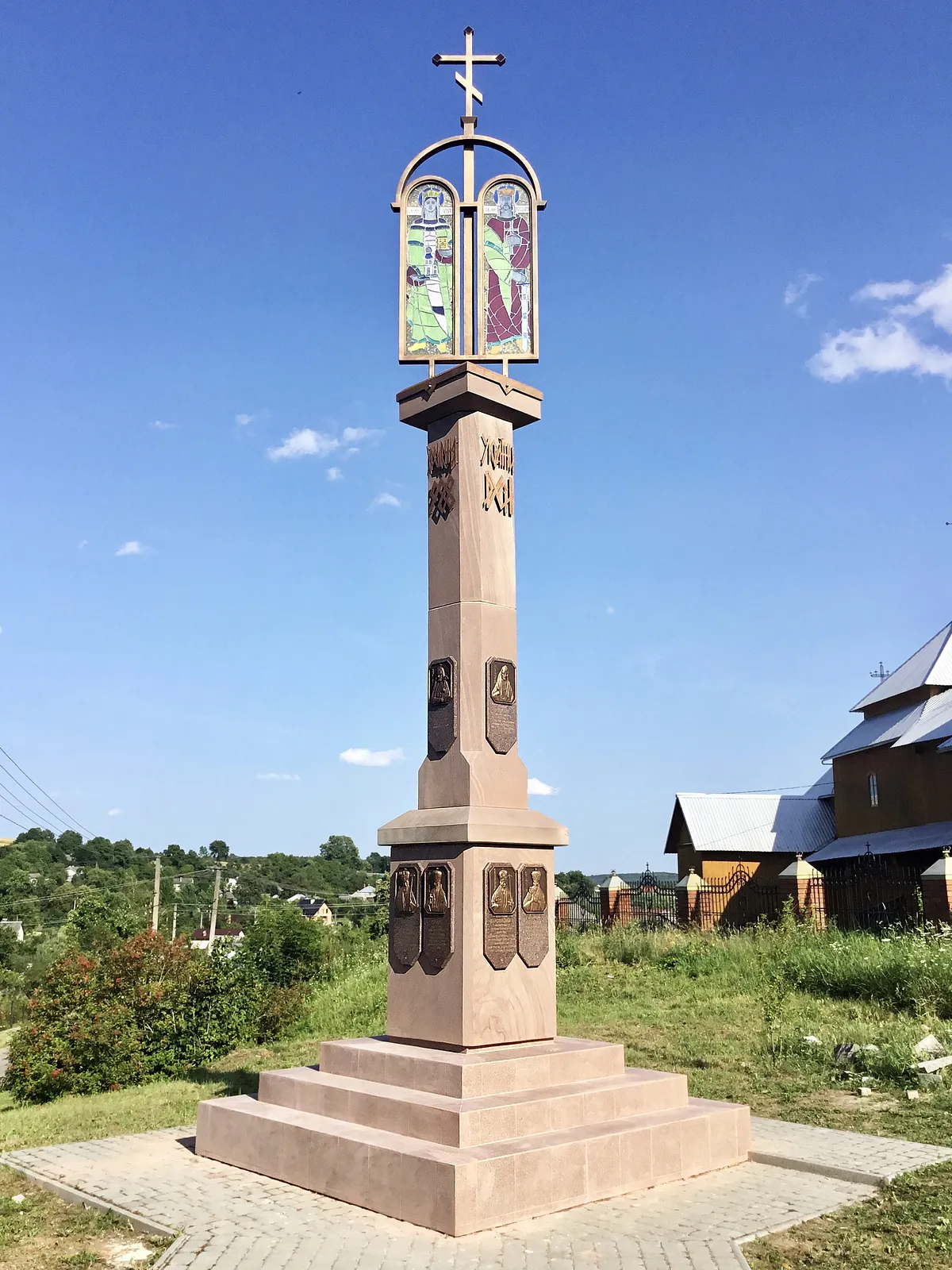 Image of Memorial sign to the granting of the Tomos of Autocephaly to the Orthodox Church of Ukraine by Roman Kykta, size: 8000/2700/2700 мм, made of Sandstone, granite, metal, glass, tinted polystone, Sculpture Monuments medium, from Vizhomlya village, Lviv region, Yavoriv district. Photo 1 of 9.